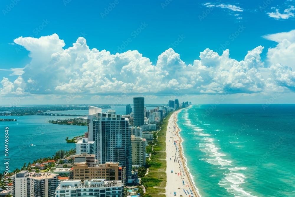 Aerial view of luxury buildings in Miami Beach, high rise apartment complexs and skyscrapers overlooking the ocean with blue sky and white clouds Generative AI - obrazy, fototapety, plakaty 