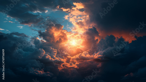 Dramatic cloudscape at sunset with glowing sun and rays