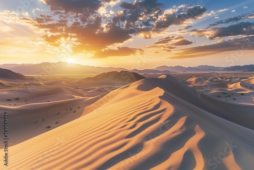 the sun is setting over the sand dunes