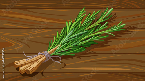  A bundle of dried rosemary traditionally used in herbal medicine for its antiinflammatory and painrelieving properties laying on a rustic wooden