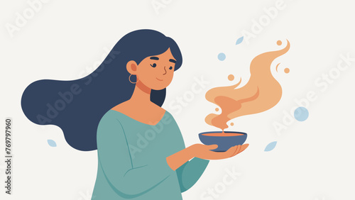  A Reiki practitioner holding a small porcelain bowl with burning sage smudging the room to cleanse the energy before a healing session. The