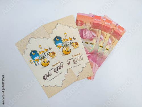 Amplop THR or Angpao or Envelopes filled with money to be given to children or family or relations during Eid al-Fitr. Money packets for Eid celebration. Hari raya concept photo