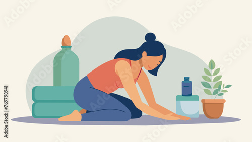  A woman rests her head on a bolster pillow as she sits in a seated forward fold her legs stretched out in front of her. A small traditional