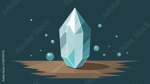  An image of a single clear quartz crystal on a wooden surface with small beads of water droplets forming on its smooth surface. The droplets