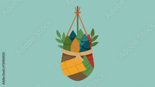  A small woven pouch filled with an assortment of dried herbs and wrapped in colorful string hangs on a hook. These pouches known as medicine
