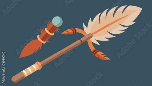  A wooden stick with feathers and beads tied to the end rests on a table surrounded by other ceremonial objects. This feather wand or fan is