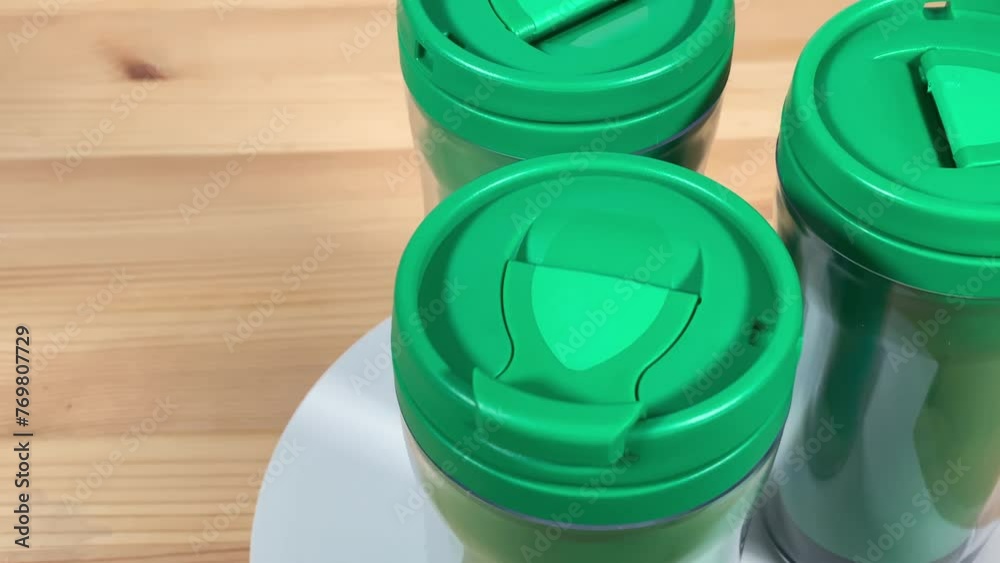 thermos mug. close-up of a thermos mug. green mug. Slow motion video. High quality video in 4K format. thermos mug. close-up of a thermos mug. green mug. Slow motion video. High quality video in 4K format.