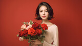 A woman is holding a bouquet of red roses. Concept of love and romance, as the woman is dressed in a white shirt and holding a beautiful arrangement of flowers. The red roses symbolize passion