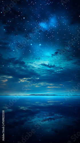 Big blue night sky with full moon above quiet sea, twilight glow, high angle, peaceful horizon © Fareedoh