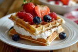 layering waffles with cream and fruit