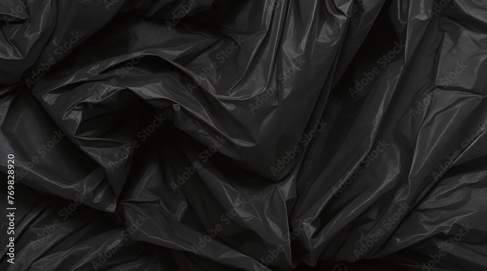 Obraz premium full frame abstract background of crumpled black plastic film bag