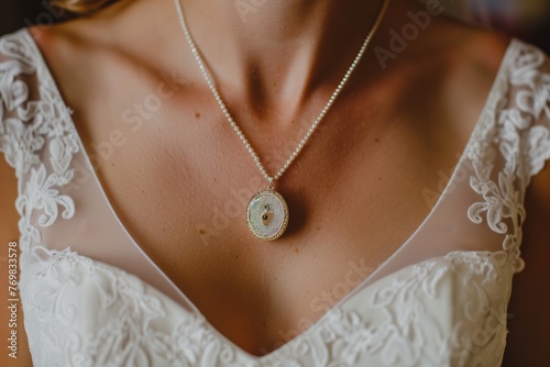 overhead view of brides neckline with a dainty locket