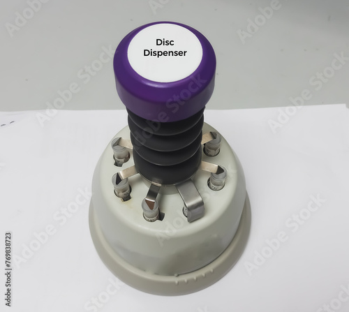 Antibiotic disc dispenser, Antimicrobial Susceptibility Disk Dispenser, Disc dispenser having ability to dispense accurately with mere depressing of handle knob for antibiogram test. photo