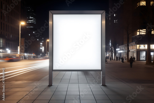 Illuminated Blank Billboard on a City Street at Night