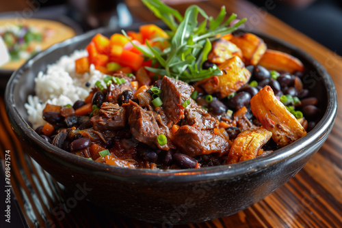 Pabellon Criollo dish featuring rice, black beans, tender beef, and sweet fried plantains. Venezuelan dish.