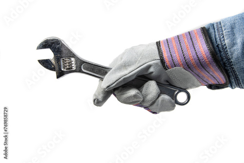 Photography a worker's hand with work gloves holding a forged steel adjustable wrench, or mo