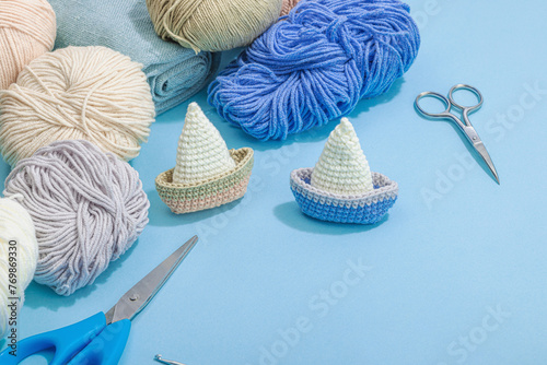 Handmade marine background. Crocheted sardine fishes, nautical style. Fishing net, sea decor photo