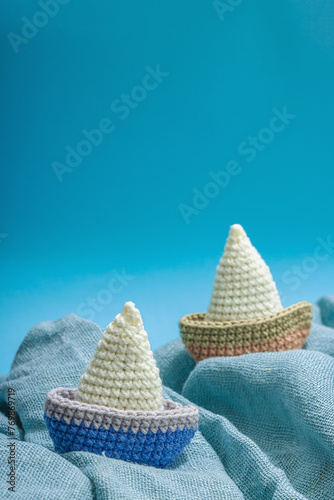 Handmade marine background. Crocheted sardine fishes, nautical style. Fishing net, sea decor photo