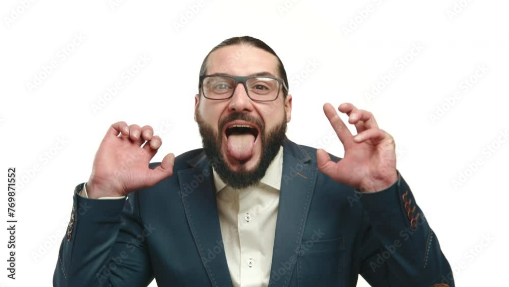 A man in a tailored suit playfully sticking out his tongue, his antics conveying humor against a pristine white background. Camera 8K RAW. A man in a tailored suit playfully sticking out his tongue, his antics conveying humor against a pristine white background. Camera 8K RAW.