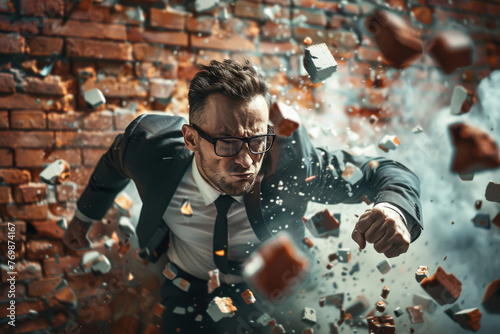 Businessman punches through a barrier wall, pursuit of success and his ability to overcome obstacles.