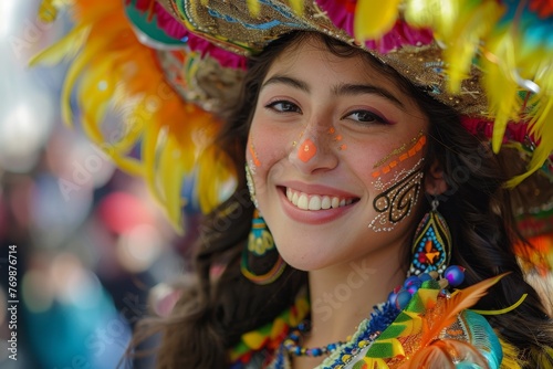 A young woman beams joyfully, adorned with a colorful and elaborate feather headdress and face paint, embodying the spirit of a cultural festival.