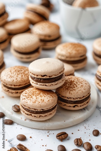Coffee flavored macaroons on white marble, indulgent sweet treats