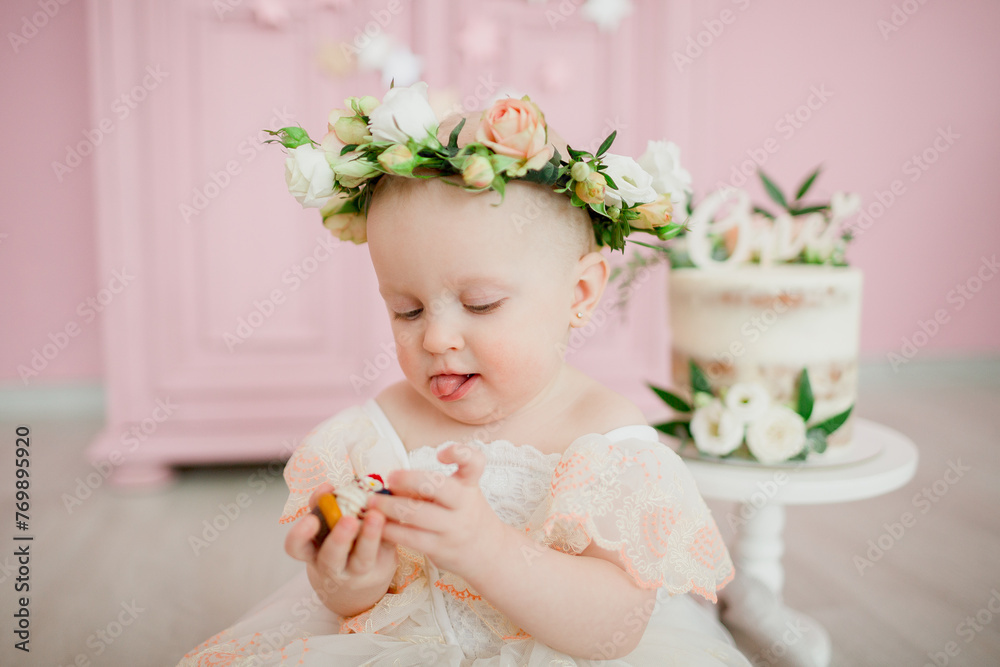 baby girl in cute dress, with cake, celebrate first birthday baby girl in cute dress, with cake, celebrate first birthday