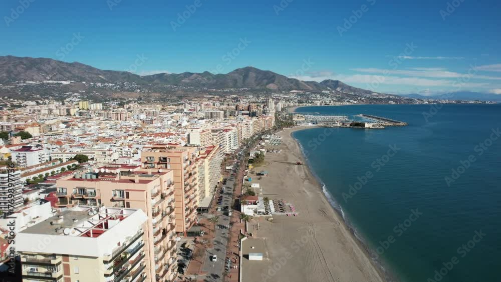 Aerial view of a coastal city being captures during the summer in south Spain Aerial view of a coastal city being captures during the summer in south Spain