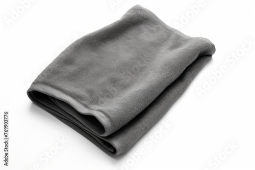 Fluffy black towel on a light background