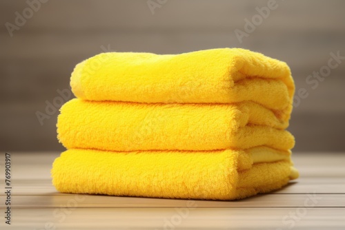 Yellow towels, neatly stacked