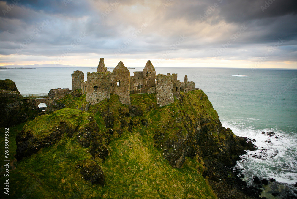Castle ruins on cliff at ocean