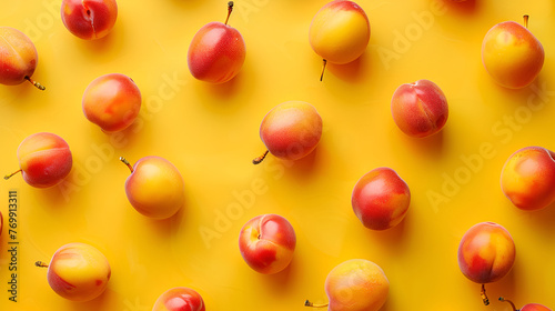 Fresh ripe peach fruits on yellow background 