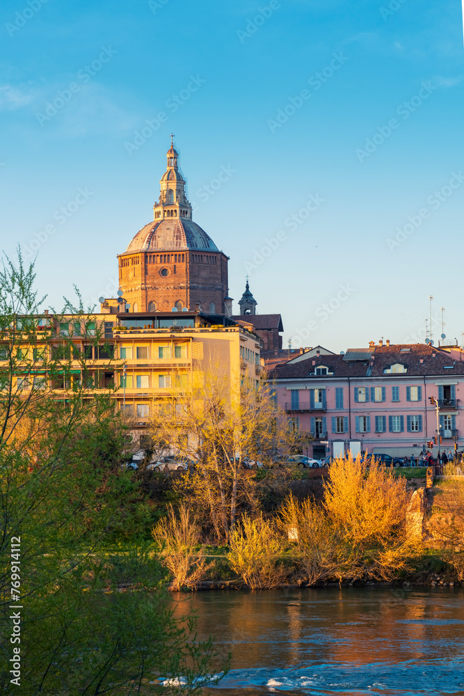 Panorama of Ponte Coperto (covered bridge) and Duomo di Pavia (Pavia Cathedral) in Pavia at sunny day, Lombardy, italy.Vertical photo.