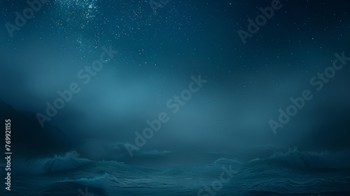 A dark blue ocean with a few stars in the sky