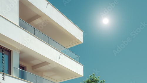 A modern apartment building with geometric shapes and white exterior walls, under the bright sun on a clear day against a blue sky Generative AI