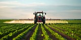 Protecting Soybean Crops: A Tractor Spraying Pesticides in a Field During Spring Agriculture. Concept Agriculture, Crop Protection, Pesticide Spraying, Tractor Operations, Spring Farming