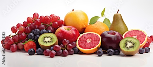 a bunch of different types of fruit are sitting on a table . High quality