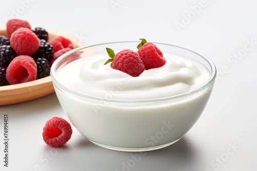 Plain yogurt or Greek yogurt in a bowl served with fresh berries