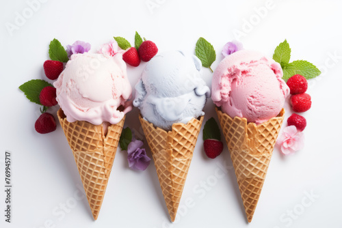 Variety of ice cream scoops fruit flavors in waffle cones against pure white background overhead view