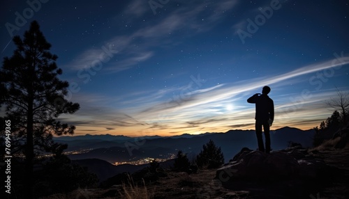 Silhouette of photographer with camera and milky way blackground.