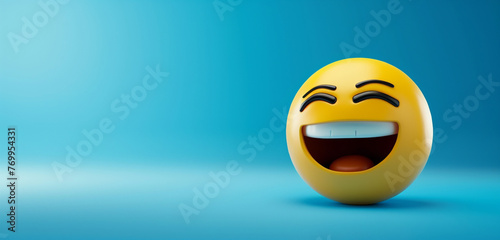 A close-up of a laughing emoji on a blue background with
