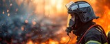 firefighter with helmet and air mask against fire flames in blur background