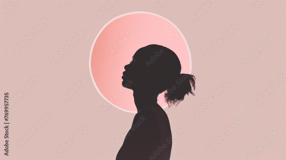 Profile view of a female silhouette against a soft pink halo, evoking a serene mood