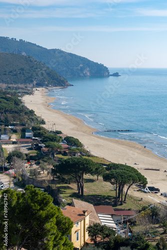 View on sandy beach from hilly medieval small touristic coastal town Sperlonga and sea shore, Latina, Italy