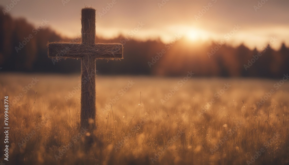 The cross on meadow autumn sunrise background