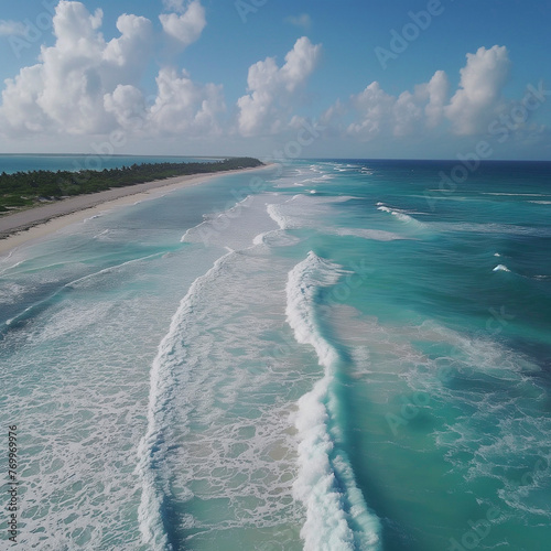 a drone view of waves breaking on a tropical beach
