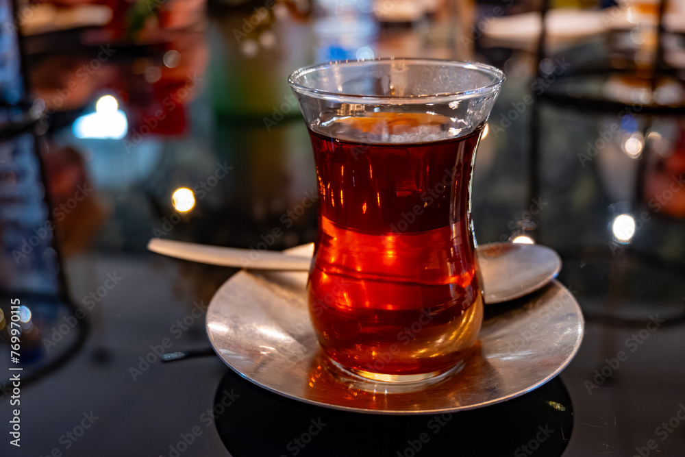 Turkish sweet tea served in traditional glass in restaurant in Istanbul, Turkey