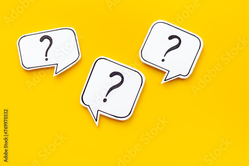 Question marks on paper speech bubbles. FAQ concept or search information concept