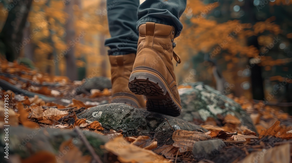 A man goes on a hiking trip through the mountains. View of feet in boots. Travel and active holiday concept