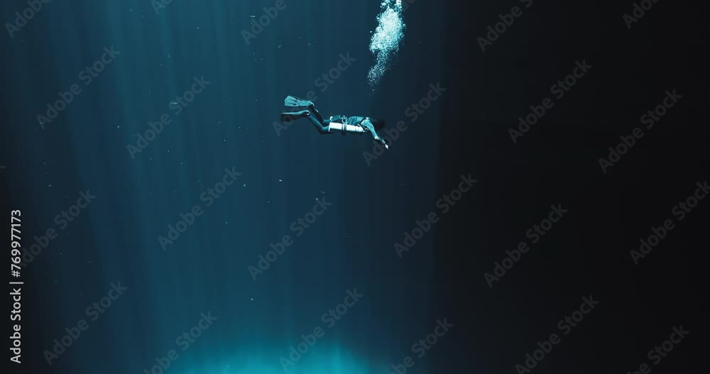 A Scuba Diver and Light Rays in Yucatan